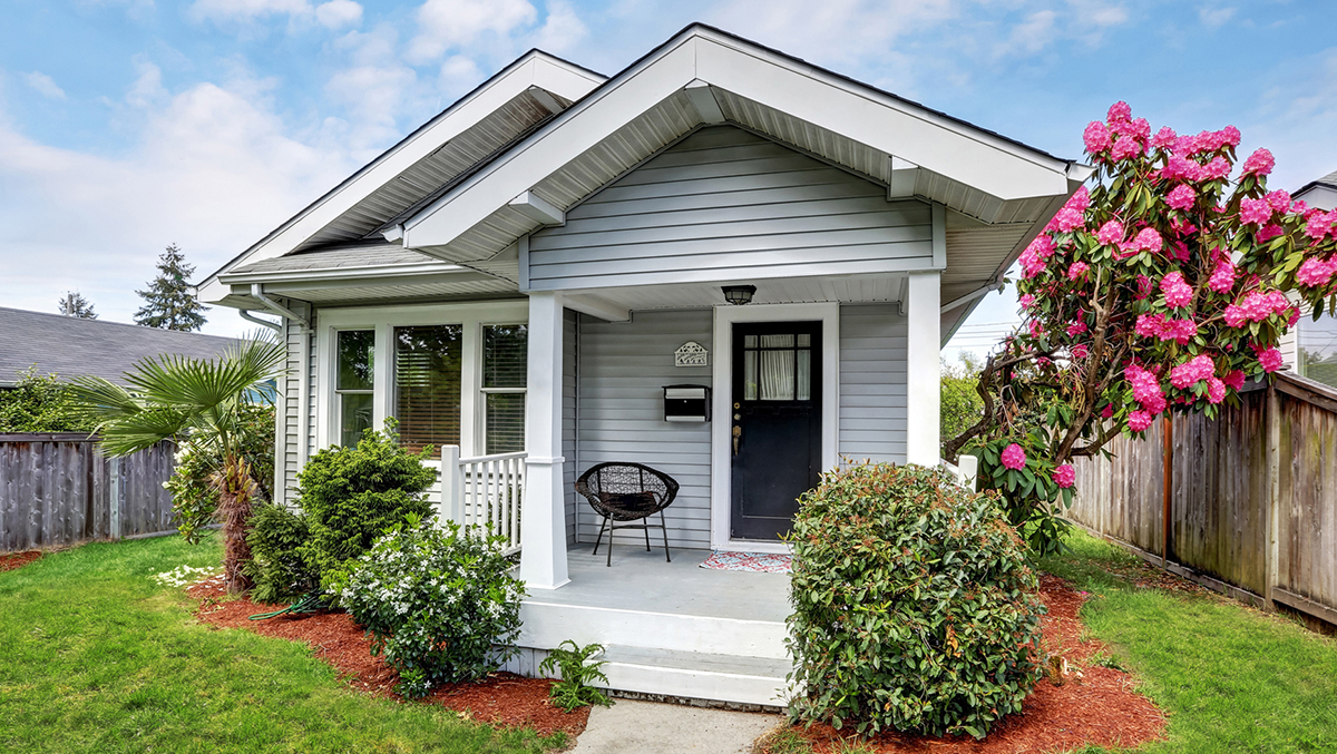 The exterior of a small, craftsman California bungalow house during a home inspection 